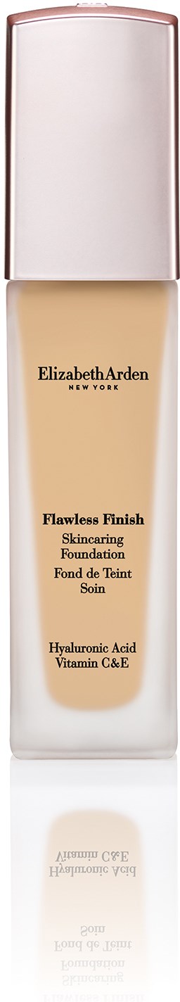 En lang flaske foundation fra Elizabeth Arden med lys væske inni og hvit lokk.