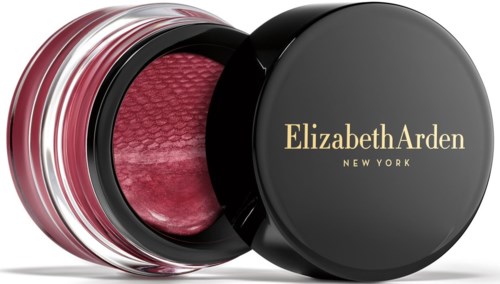 En svart rund behållare med gul text, öppen för att visa rosa makeup eller rouge inuti.