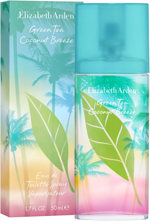 A perfume bottle in front of a colorful box with a tropical palm tree design and green leaves.