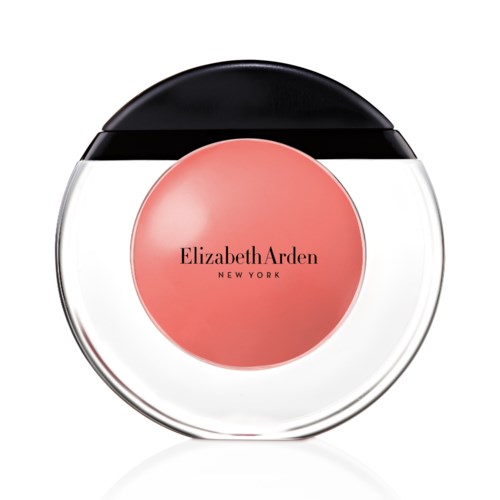 En rund kosmetikkontainer med svart lock, genomskinlig fall och rosa etikett som säger Elizabeth Arden New York.