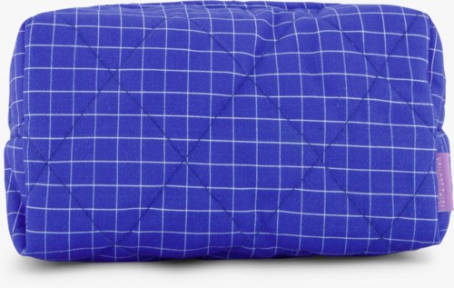 Blue quilted bag with white grid lines, soft and padded, rectangular shape with a zipper.