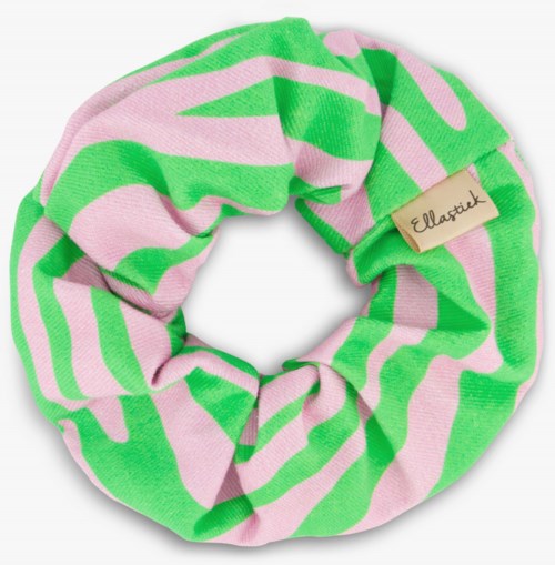 A colorful fabric hair scrunchie with pink and green stripes and a beige tag reading 'Elariet'.