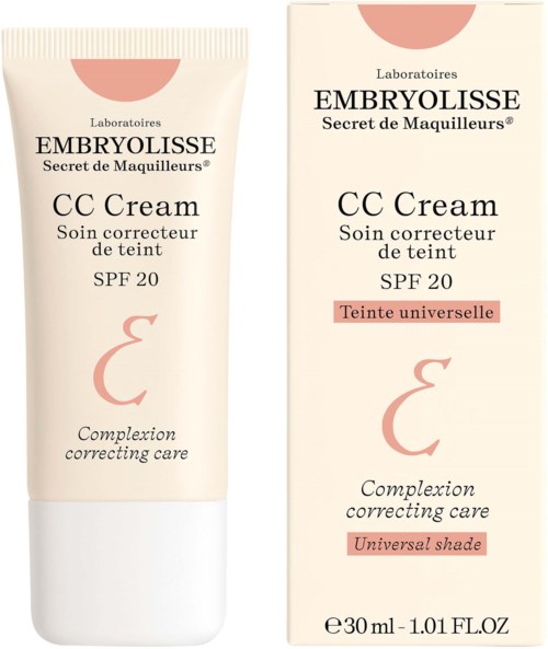 En tube og eske for Embryolisse CC Cream med SPF 20, for hudkorrigering og universell nyanse, i lyse rosa og off-white farger.
