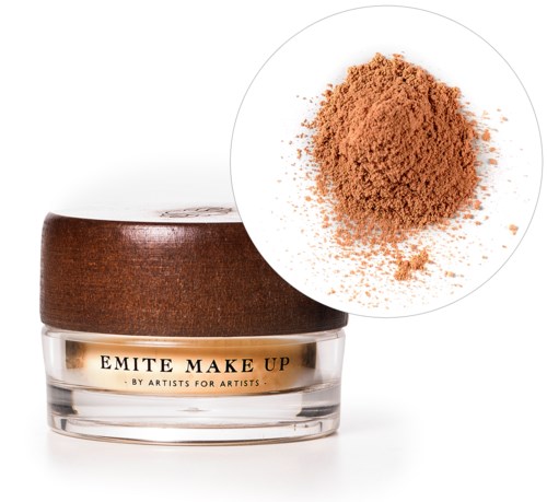A small jar of makeup powder with a brown lid and golden label. A close-up shows the powder's light brown color.