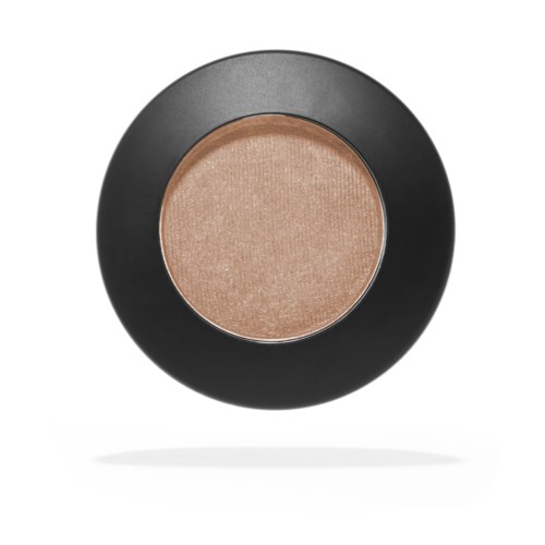 A circular makeup compact with a beige or light brown powder inside.
