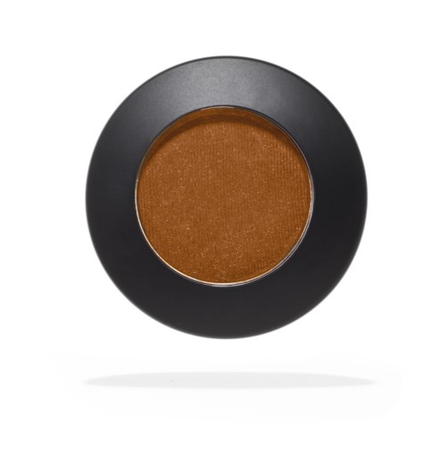 A round makeup eyeshadow with a black border and coppery-brown color in the center.