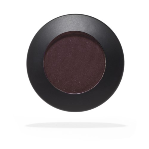 A round, dark makeup compact with a reddish-brown powder inside.