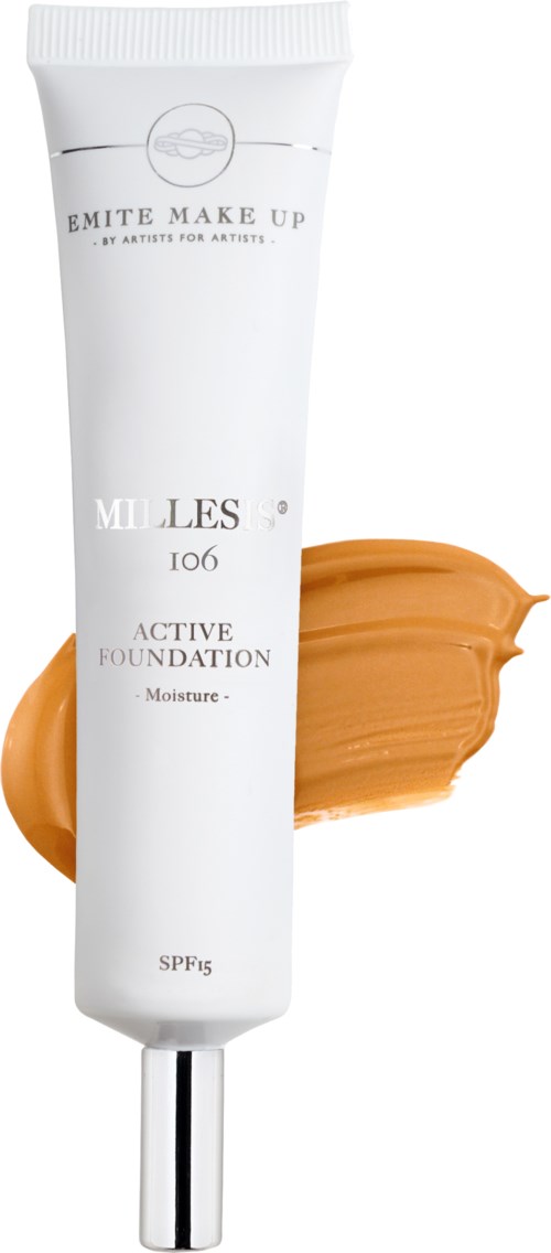 A white tube of foundation with a silver cap, with beige foundation spilled beside it.