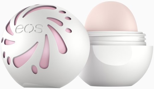 En rund behållare med ett pastellrosa lock, designad för hudvård eller kosmetika, med ett bladformat snitt på locket.