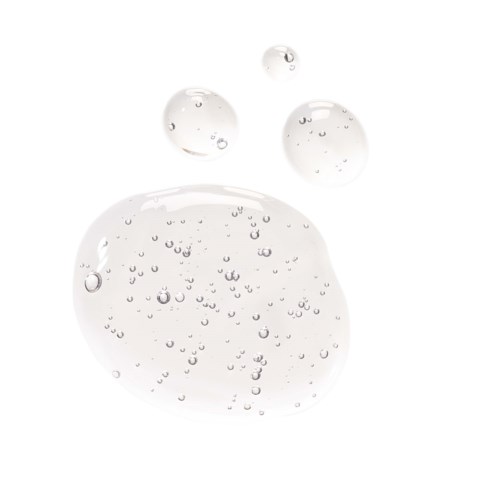 Bubbles of various sizes floating in clear water with a white background.