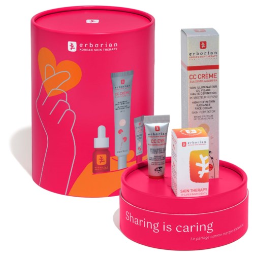 A pink skincare gift set with creams, a dropper bottle, and a box, all branded Erborian and labeled for skin therapy.