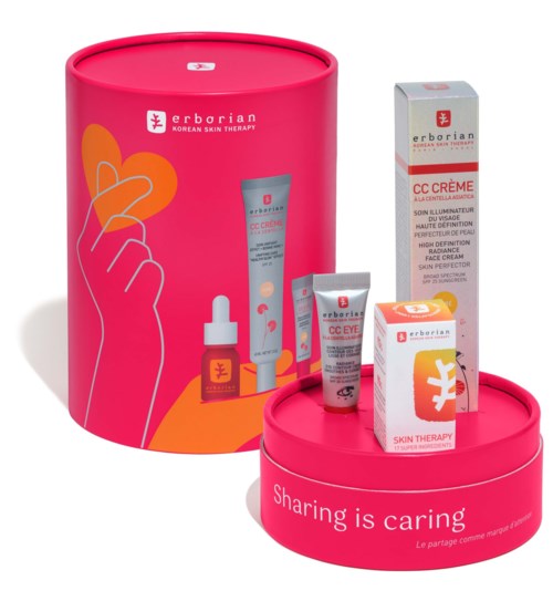 A skin care gift set includes creams, serum, and eye gel in pink packaging with a loving hand illustration.