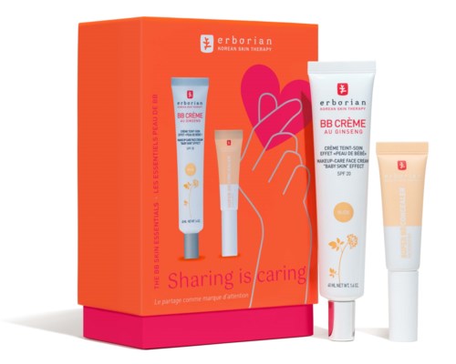 A skincare set with cream tubes and a box, featuring bright orange and white colors, and the slogan "Sharing is caring."
