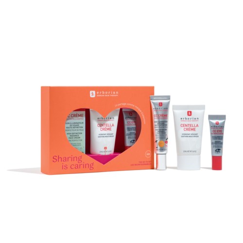 A skincare set includes a box and four tubes or jars, labeled for face care, with red and white packaging.