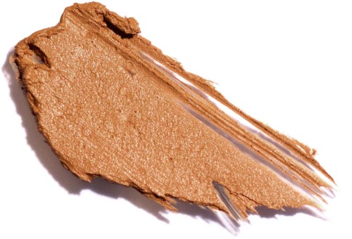 En klat af lys brun makeup eller creme på hvidt papir med en stribet tekstur.