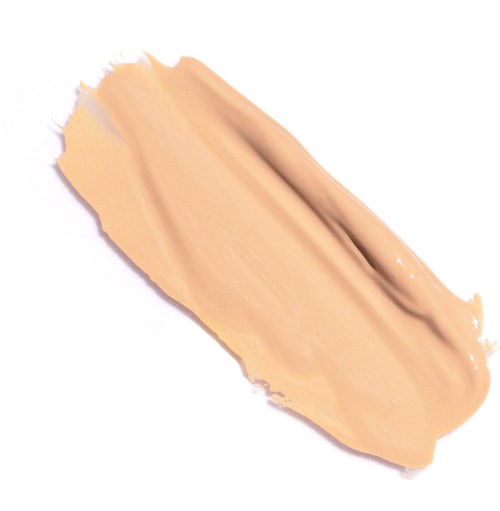 Beige neste levitä valkoisella pinnalla, mahdollisesti meikkivoide tai lotion.