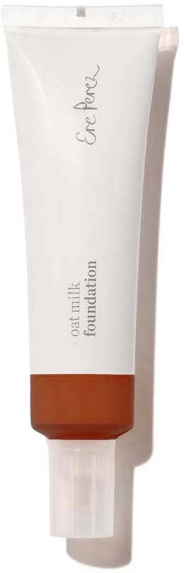 En vit tub med havremjölksgrundning med en bruns band och lock, med titeln 'Serum Perfection' på förpackningen.