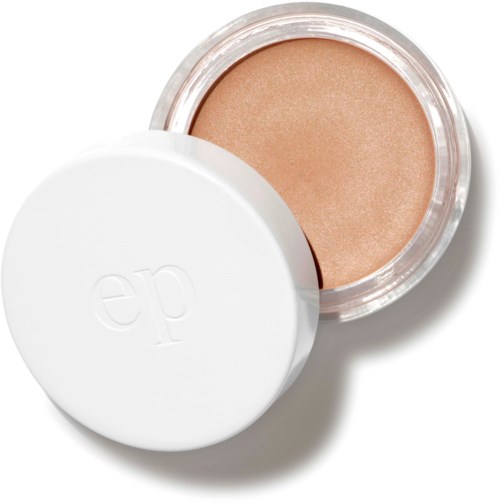 En lille rund beholder med beige makeup og hvid låg med bogstaverne "ep".