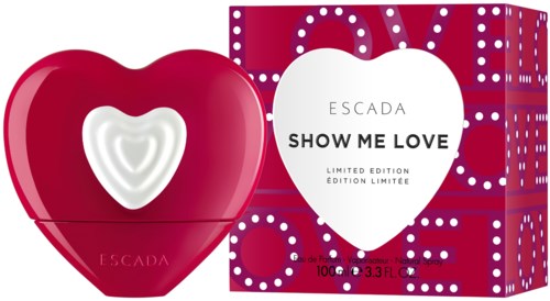 En hjärtformad parfyllflaska och låda med kärlekstema, i röda och vita färger, som visar 'Show Me Love'.