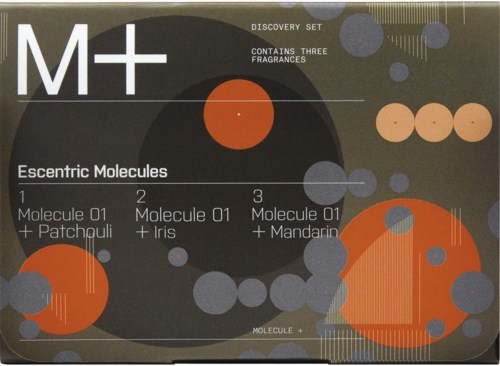 A box featuring the M+ logo, three different fragrance combinations, and colorful molecule illustrations on a dark background.