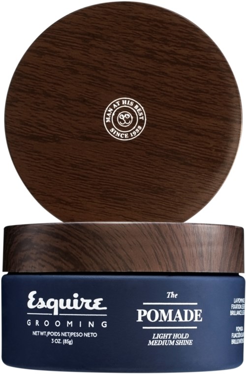 En mørk brun beholder med hårvoks og svart lokk, merket som 'The Pomade' for lett til middels hold.
