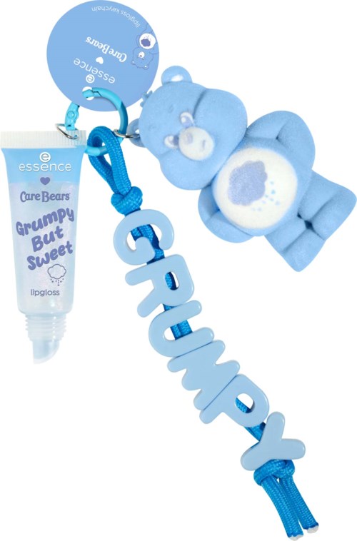 Niebieska maskotka Care Bears, brelok z niebieskim napisem "Gummy Pip Grow" i błyszczyk do ust Essence.