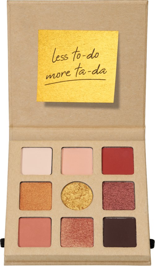 Ein offener Make-up-Palette mit neun bunten Tönen und einem gelben Zettel mit "less to-do, more ta-da."