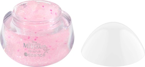 Pieni purkki pinkkiä voidetta ja valkoinen lasta. Vaahto sisältää pieniä pinkkejä hippuja.