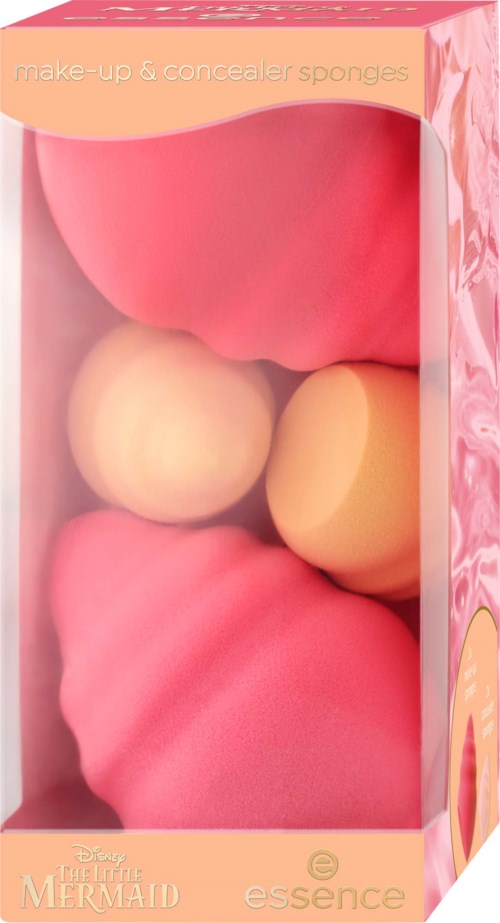 Rosa och beige sminksvampar och concealersborttagare i en box formad som ett snäcka.