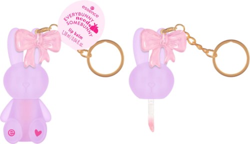 Två små läppglansbehållare i form av kaniner i rosa och lila med rosetter, kopplade till en nyckelring.