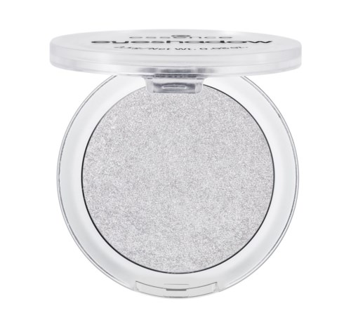 A round silver eyeshadow with a white lid, partially open, showing a shimmery texture inside.