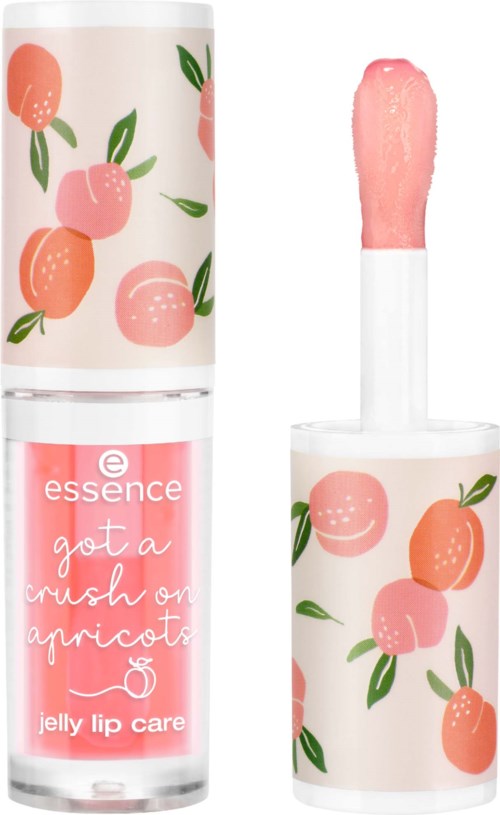 A lip gloss tube with a peach pattern, and a pink lip gloss applicator. The label says 'got a crush on apricots'.
