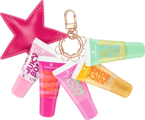 Bunte Lipgloss und Hautpflegeprodukte an einem Schlüsselbund mit einem pinken Stern. Die Produkte sind in Tuben mit auffälligen Etiketten.