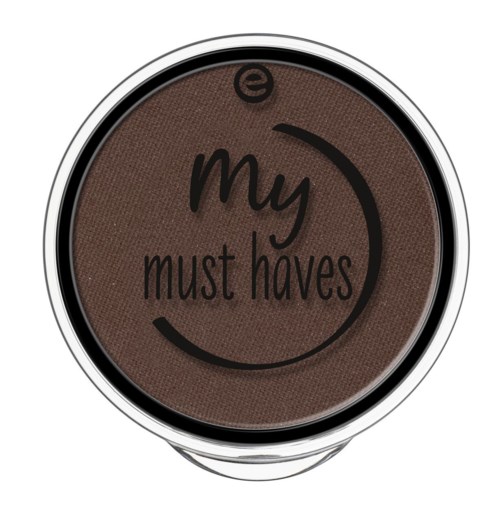 Een ronde make-upproduct genaamd "my must haves" in bruine kleur, met zwarte en witte tekst en ontwerp.