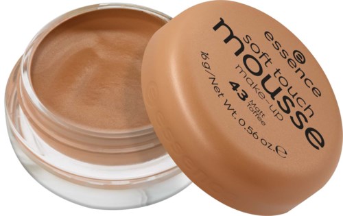 Ein Behälter mit beiger Makeup-Creme, Deckel halb geöffnet, zeigt die Creme drin.