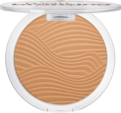 En kompakt med ljusbrunt, vågformat pressat puder i ett runt vitt skal.