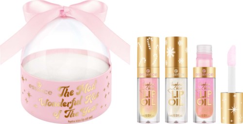 Ett rosa och guld läppglansset i en rund ask med rosa band, tre läppglansflaskor och en applicator.