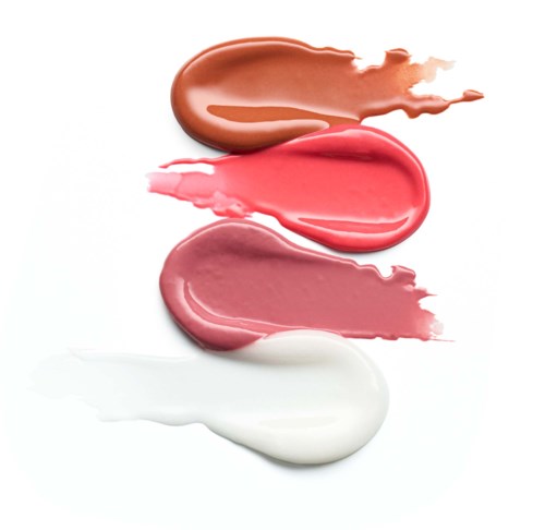 Fyra färgprover eller makeupskuggor i bruna, rosa och vita nyanser, utbredda i en rad på en vit bakgrund.