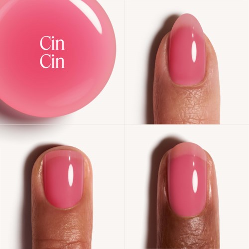 Ein Nagellackflasche mit rosa Farbe und vier Ansichten einer lackierten Nagel. Das Etikett lautet "Cin Cin".
