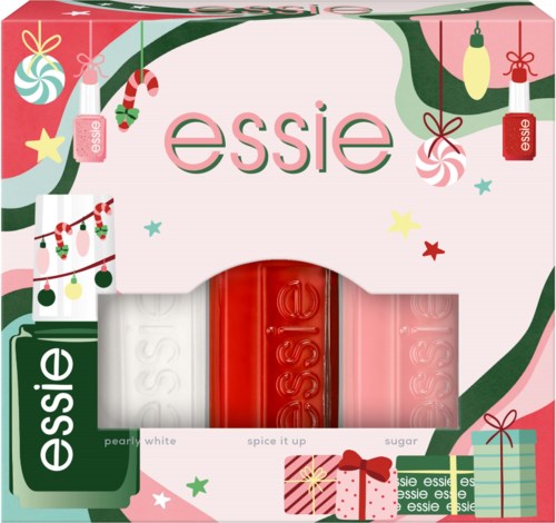 Festlig förpackning med tre Essie nagellack i vitt, rött och rosa, omgiven av juldekorationer och presenter.