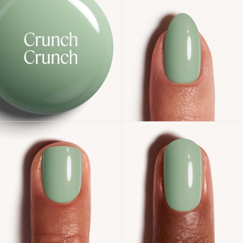 Grön nagellack på ett finger, med en rund grön boll märkt "Crunch Crunch" i närheten.