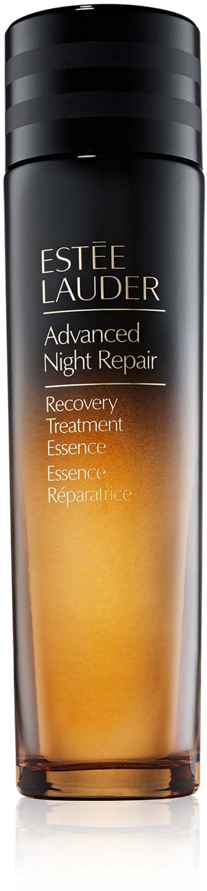 A tall, cylindrical bottle of Estée Lauder Advanced Night Repair serum with a black cap and orange-tinted liquid inside.