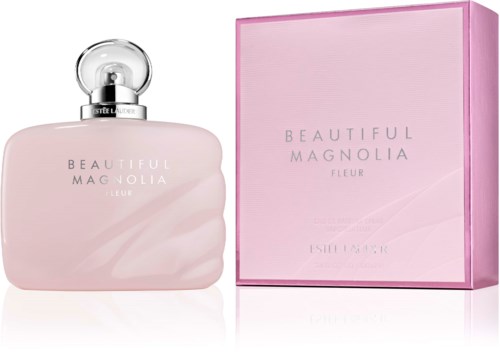 Różowa butelka perfum z srebrnym korkiem i dopasowanym różowym pudełkiem, oznaczony "Beautiful Magnolia Fleu."