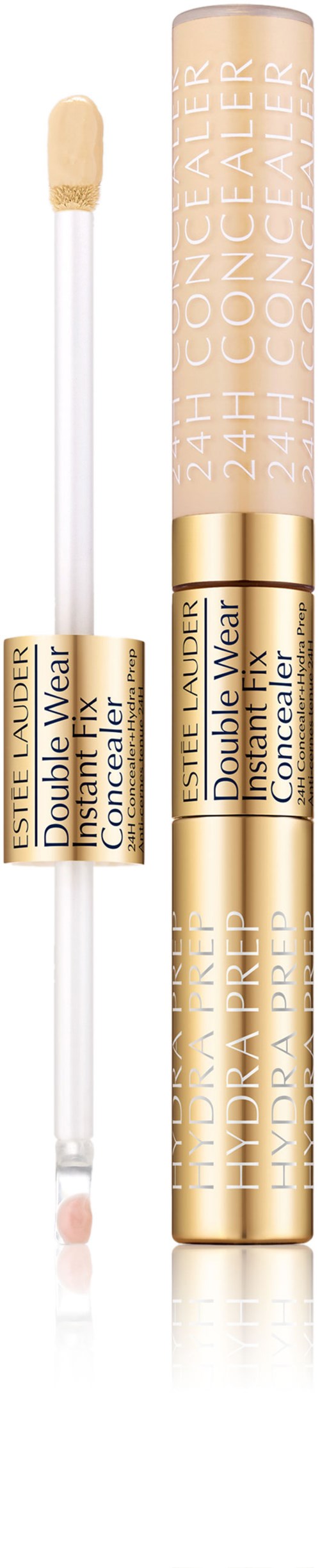 En beige pen med gulddetaljer och text. Den verkar vara ett concealer- eller makeupprodukt, med applicatorspets.