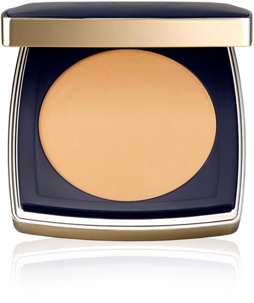A compact with beige powder inside and a shiny black and gold case.