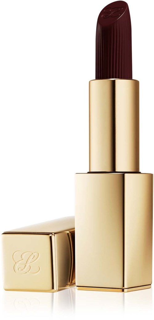A dark red lipstick in a shiny gold case standing upright, with the cap placed sideways.