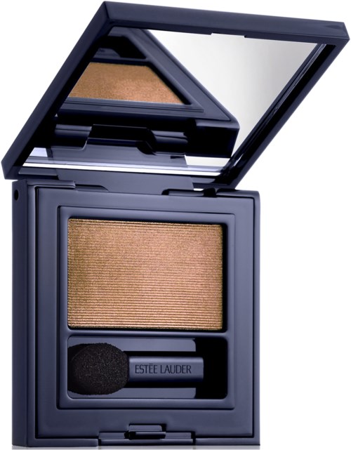 A compact eyeshadow case with a mirror inside, containing a bronze-colored eyeshadow and a small applicator.
