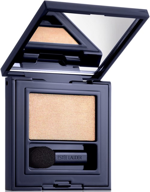 A beige eyeshadow compact with a mirror, sponge applicator, and Estée Lauder branding inside.