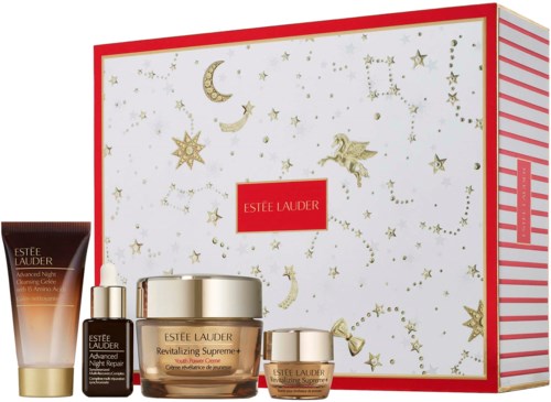 A set of Estee Lauder skincare products with a festive-themed box featuring stars and moons.