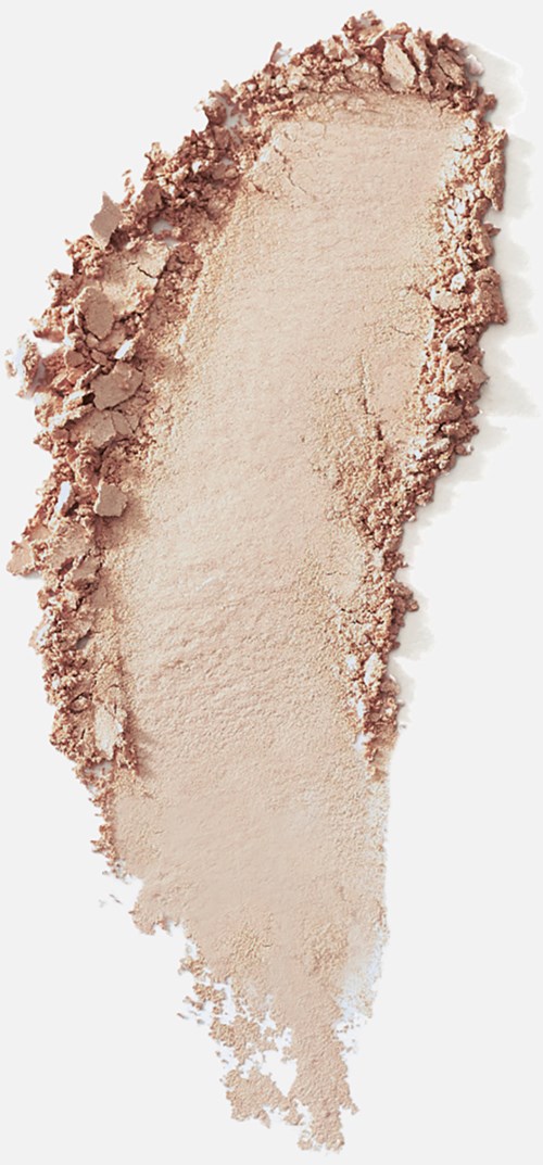 En tests av beige pulveriserad makeup eller pigment med ojämna kanter.